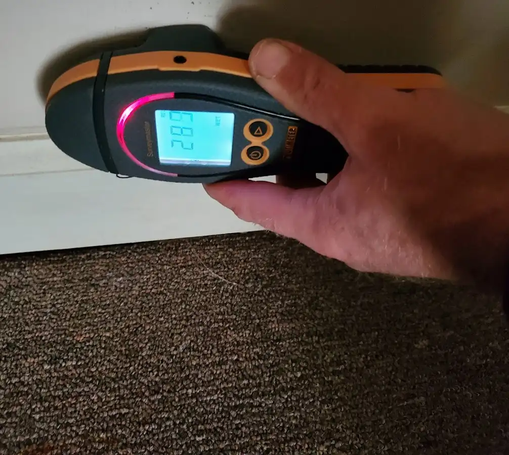 Moisture detection at baseboard during Burst Pipe Cleanup in West Puente Valley